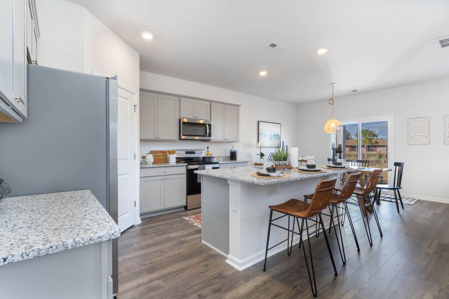 Furnished interior in a model home at Island Green in Myrtle Beach (Image 9).
