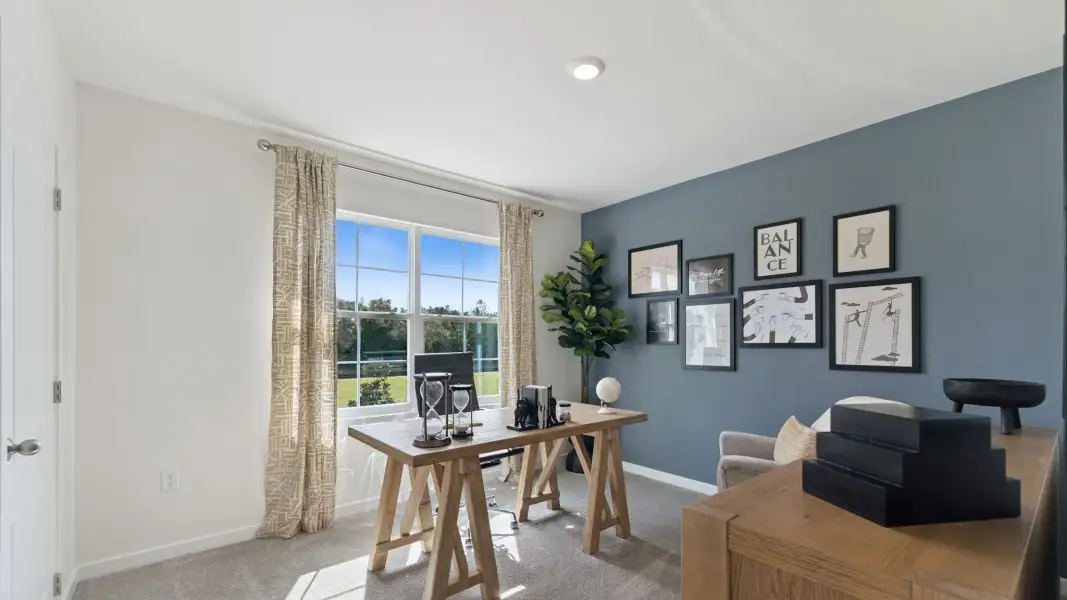 Furnished interior in a model home at Travis Landing in Kissimmee (Image 17).