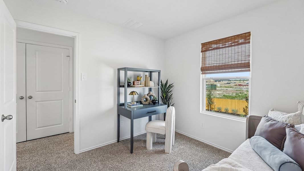 Furnished interior in a model home at Marigold in Kyle (Image 32).