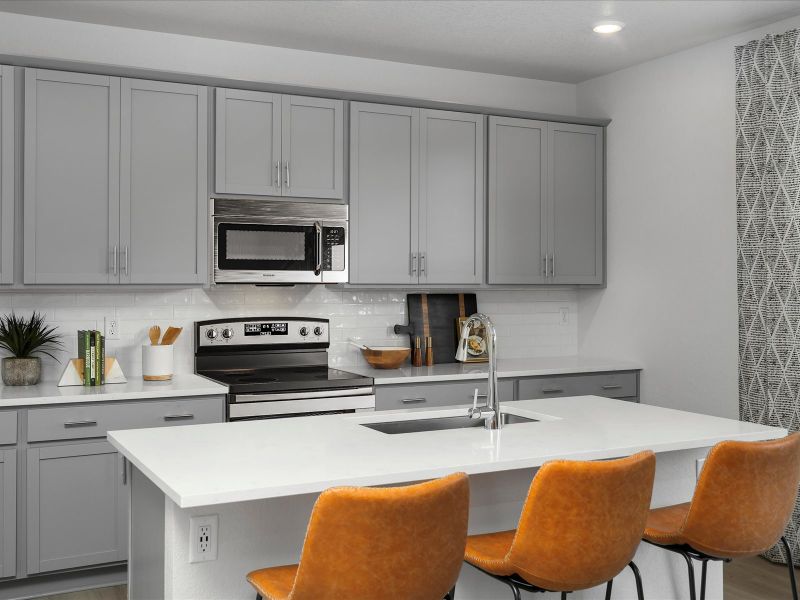Furnished interior in a model home at Frontier Estates - The Trails Collection in Firestone (Image 3).