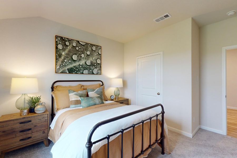 A bedroom with a bed and lamps. A bedroom with a bed and lamps.