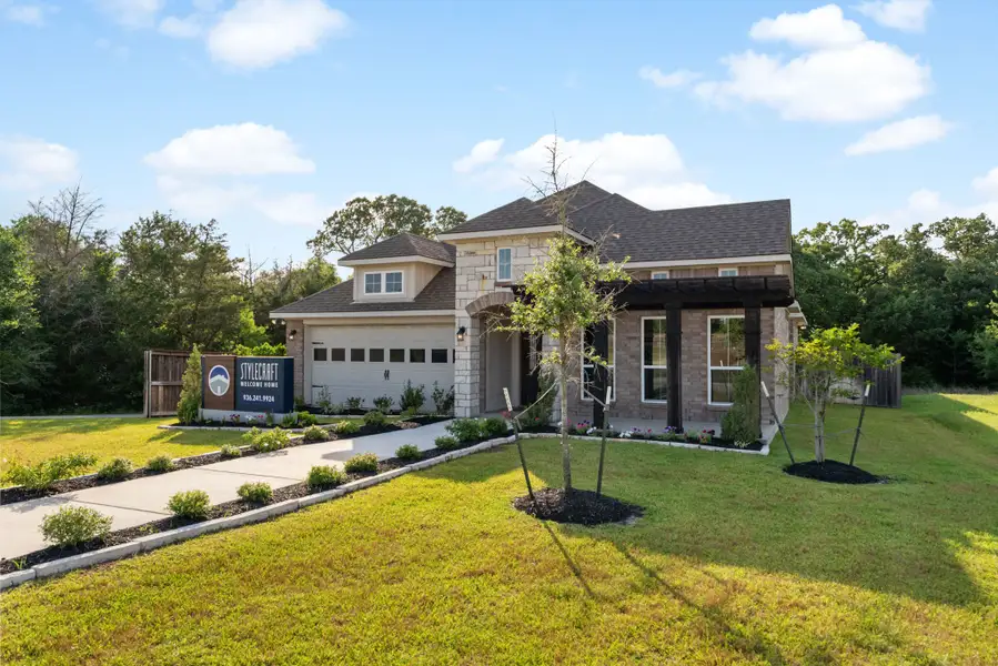 Front exterior of a home in the The Executive Collection at Yaupon Trails community, located in Bryan, TX (Image 2). Front exterior of a home in the The Executive Collection at Yaupon Trails community, located in Bryan, TX (Image 2).