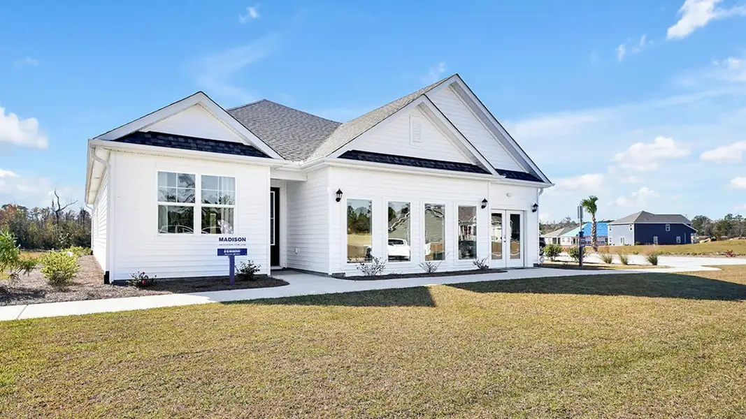 Front exterior of a home in the The Highlands at Cedar Hill Landing community, located in Navassa, NC (Image 5). Front exterior of a home in the The Highlands at Cedar Hill Landing community, located in Navassa, NC (Image 5).