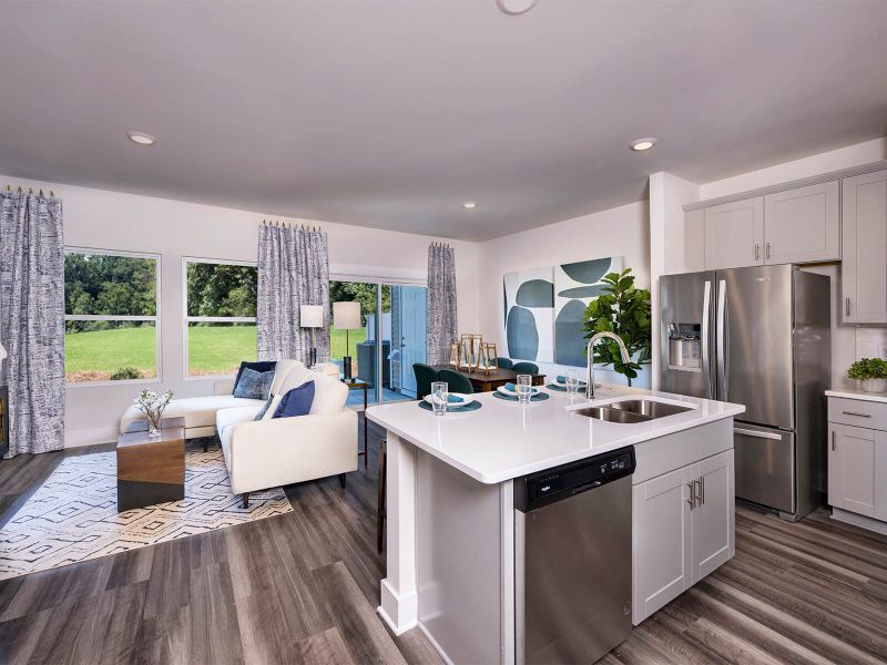 Prep dinner in the kitchen while entertaining guests. Photography from Townes at Garrison Grove. Prep dinner in the kitchen while entertaining guests. Photography from Townes at Garrison Grove.