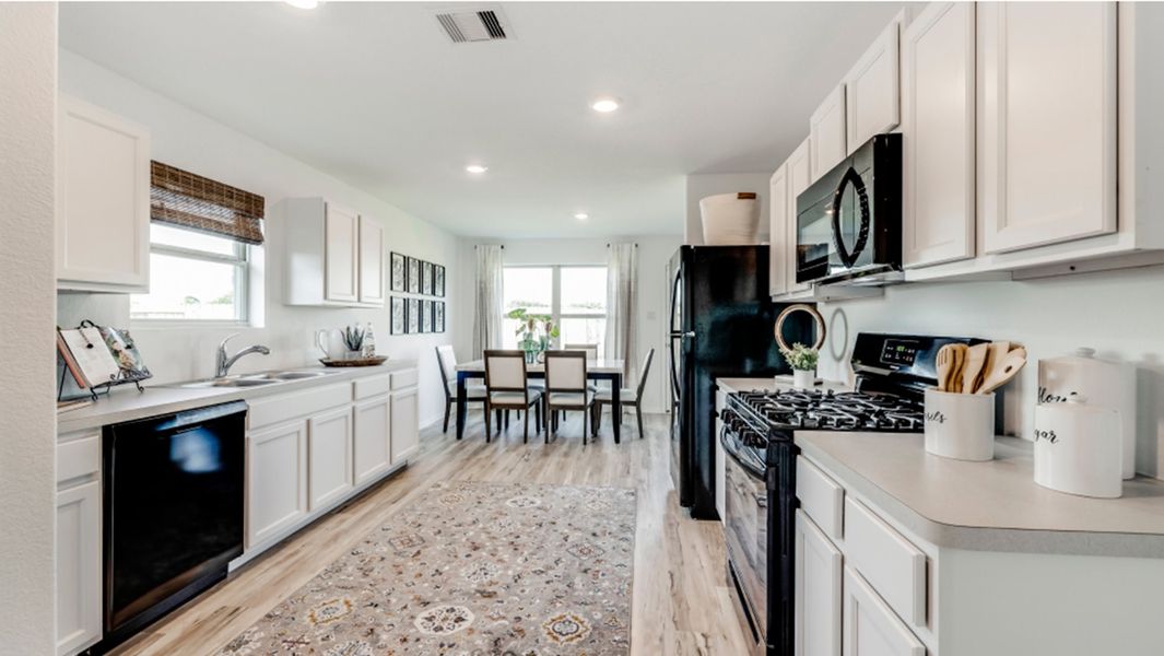 Furnished interior in a model home at Riverwood Ranch: Colonial & Cottage Collections in Angleton (Image 7).