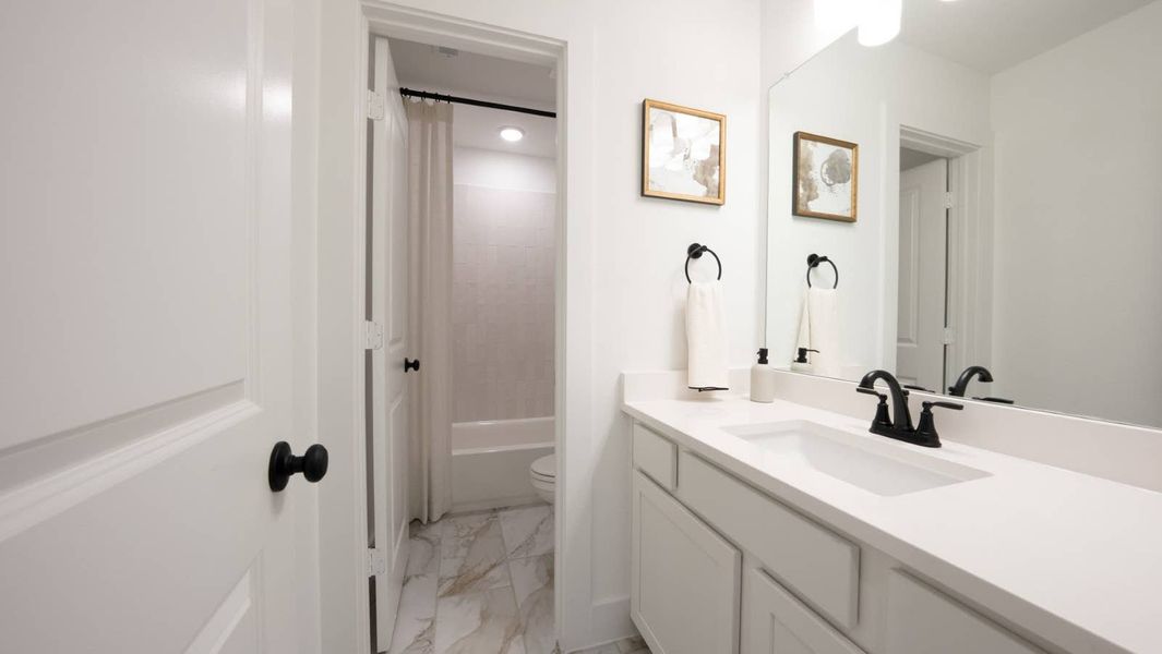 Furnished interior in a model home at Brookfield in Melissa (Image 40).