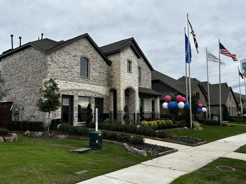 Front exterior of a home in the Heartland: Lonestar Collection community, located in Heartland, TX (Image 4). Front exterior of a home in the Heartland: Lonestar Collection community, located in Heartland, TX (Image 4).