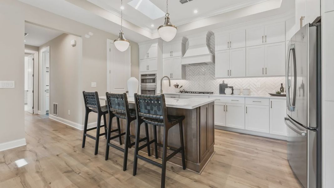 Furnished interior in a model home at The Courtyards at Post Road in Cumming (Image 8).