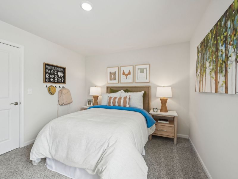 Three secondary bedrooms surround the upstairs loft.