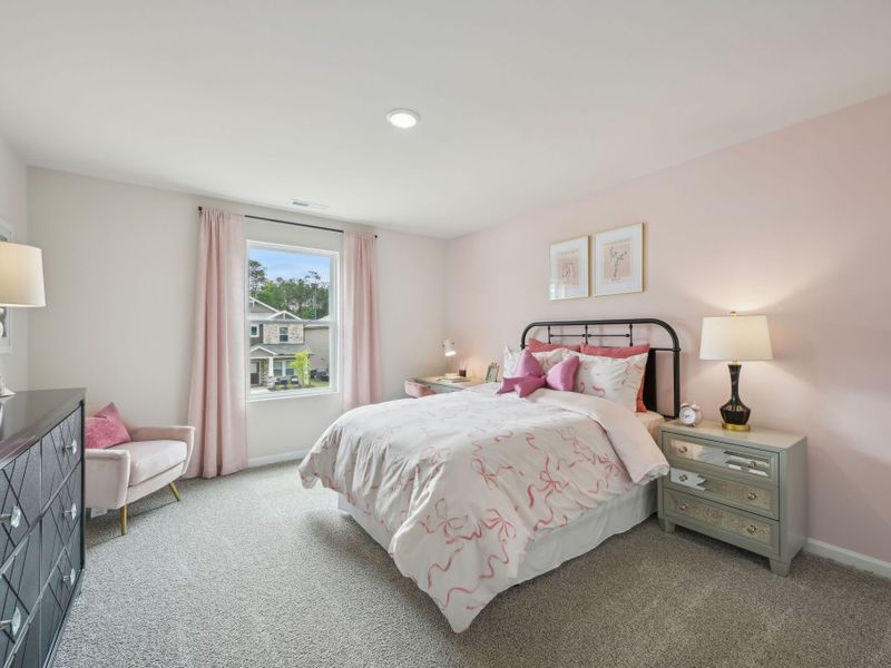 Three secondary bedrooms surround the upstairs loft.
