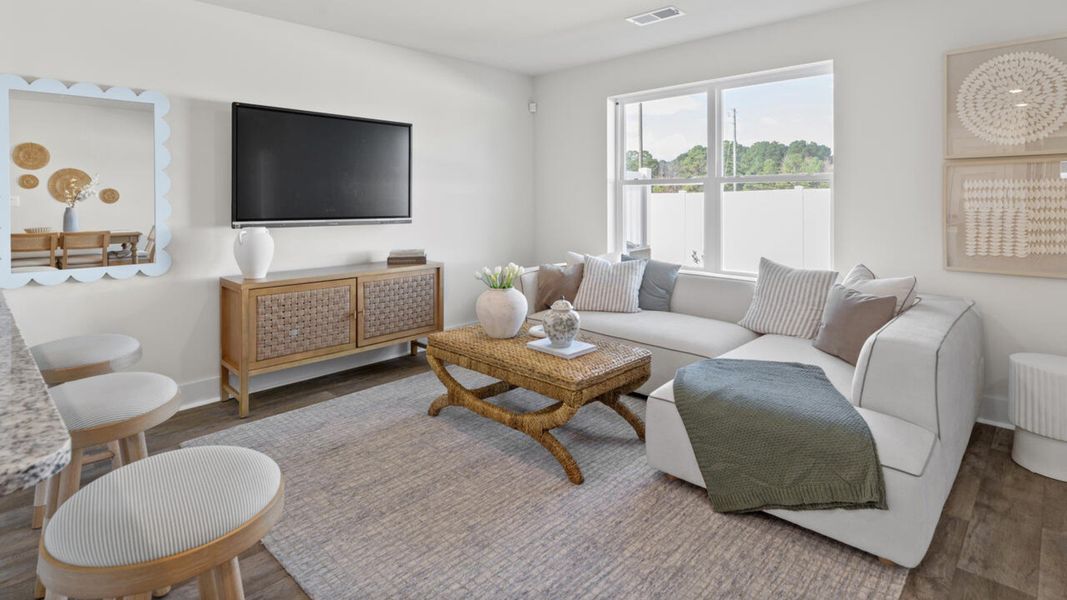 Furnished interior in a model home at Waterside Townhomes in Surf City (Image 14).