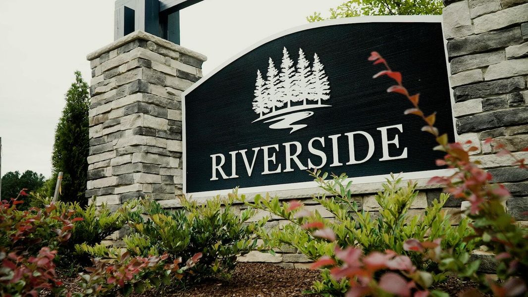 Entrance to the Riverside community in Zebulon, NC, featuring signage and landscaping (Image 2). Entrance to the Riverside community in Zebulon, NC, featuring signage and landscaping (Image 2).