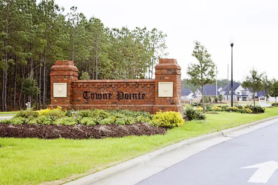 Entrance to the Patriot Pointe community in Jacksonville, NC, featuring signage and landscaping (Image 1). Entrance to the Patriot Pointe community in Jacksonville, NC, featuring signage and landscaping (Image 1).