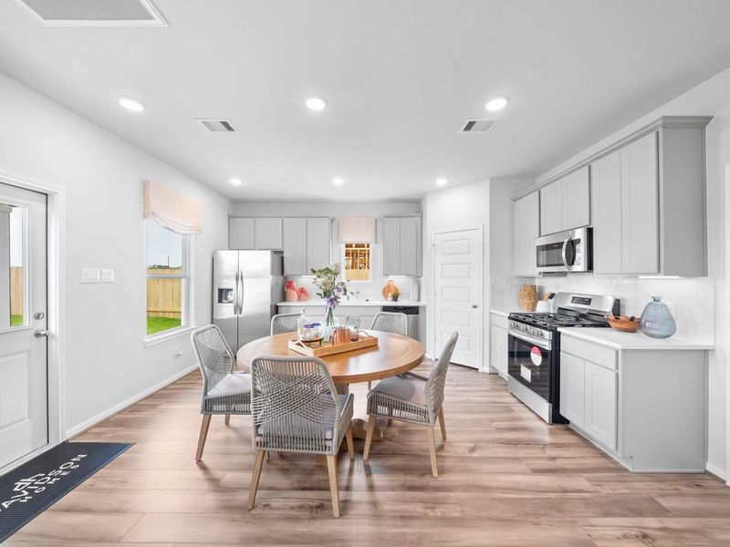 Furnished interior in a model home at Hill & Dale Ranch in Splendora (Image 10).