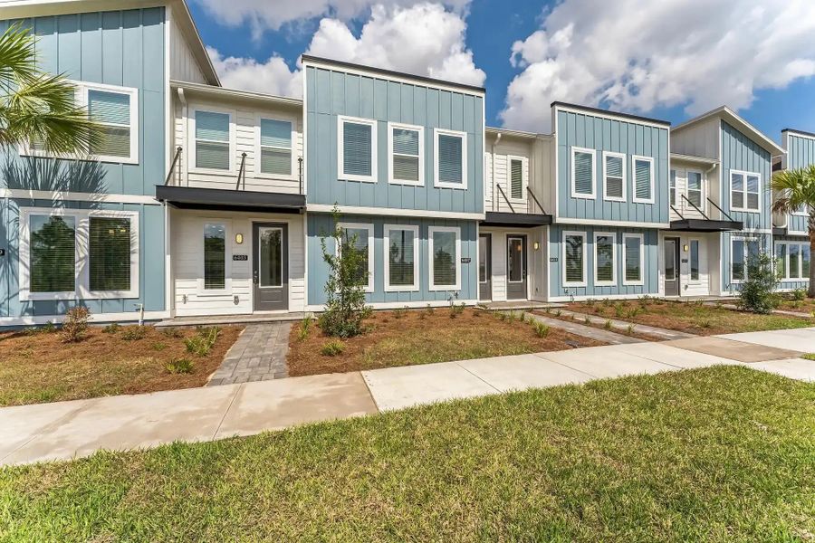 Street view of homes within the Sunbridge master-planned community in St. Cloud, FL (Image 22).