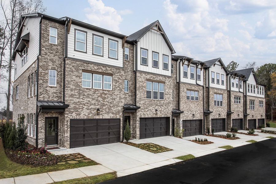 Front exterior of a home in the Towne Village at Suwanee Dam community, located in Sugar Hill, GA (Image 2).