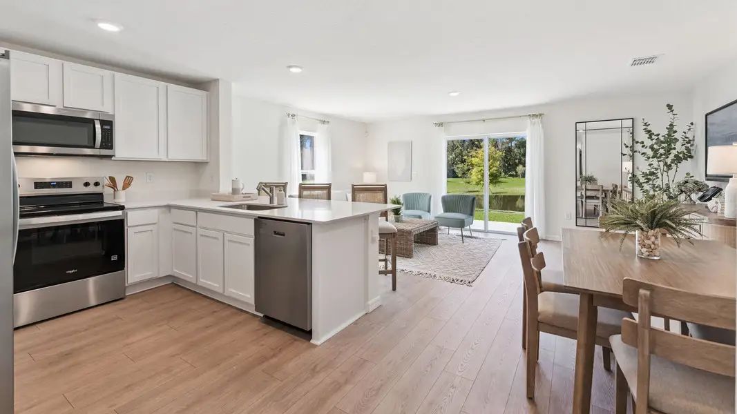 Furnished interior in a model home at Fish Lake Cove in Kissimmee (Image 12).