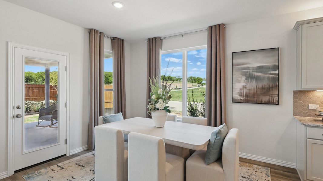 Sleek dining space with plush seating, artful accents, and abundant natural light in Green Oaks Preserve. Sleek dining space with plush seating, artful accents, and abundant natural light in Green Oaks Preserve.