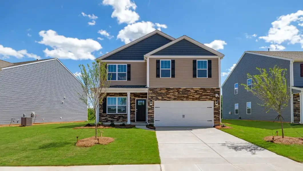 Front exterior of a home in the Ashenwood Commons community, located in Monroe, NC (Image 1). Front exterior of a home in the Ashenwood Commons community, located in Monroe, NC (Image 1).
