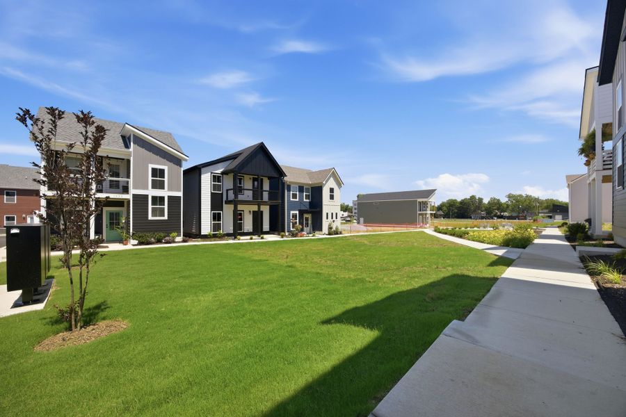 Residents enjoy shared green spaces and gathering areas designed to encourage connection and outdoor living at The Parks of Mill Town.