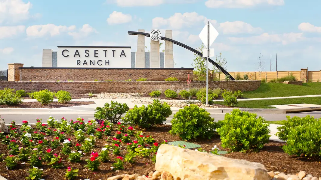 Entrance to the Casetta Ranch community in Kyle, TX, featuring signage and landscaping (Image 2).