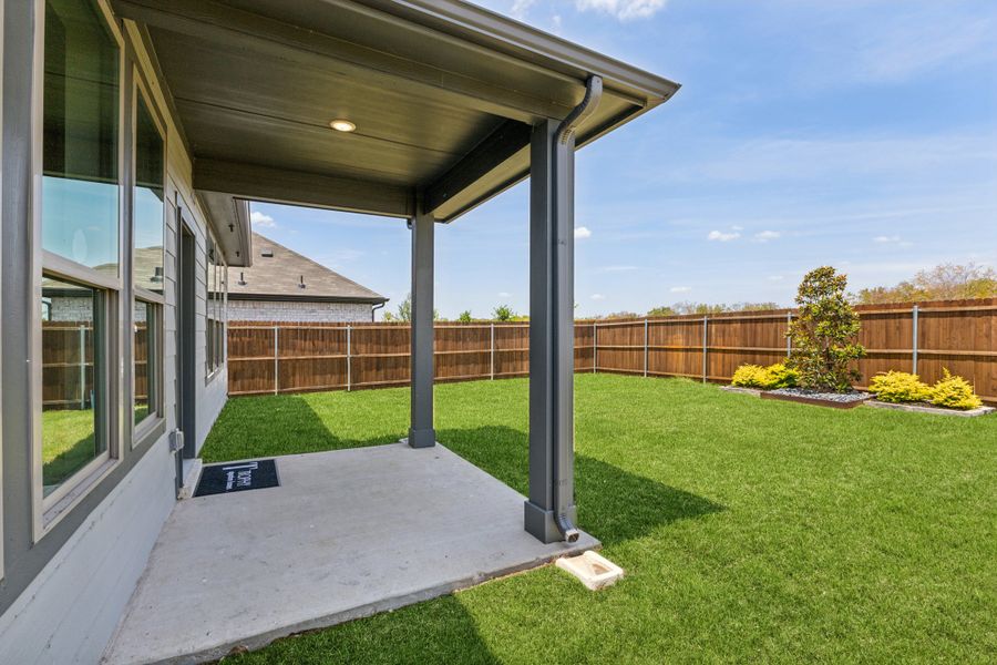 REPRESENTATIVE PHOTO – Covered Patio in a Stratton Place new home in Greenville TX by Trophy Signature Homes