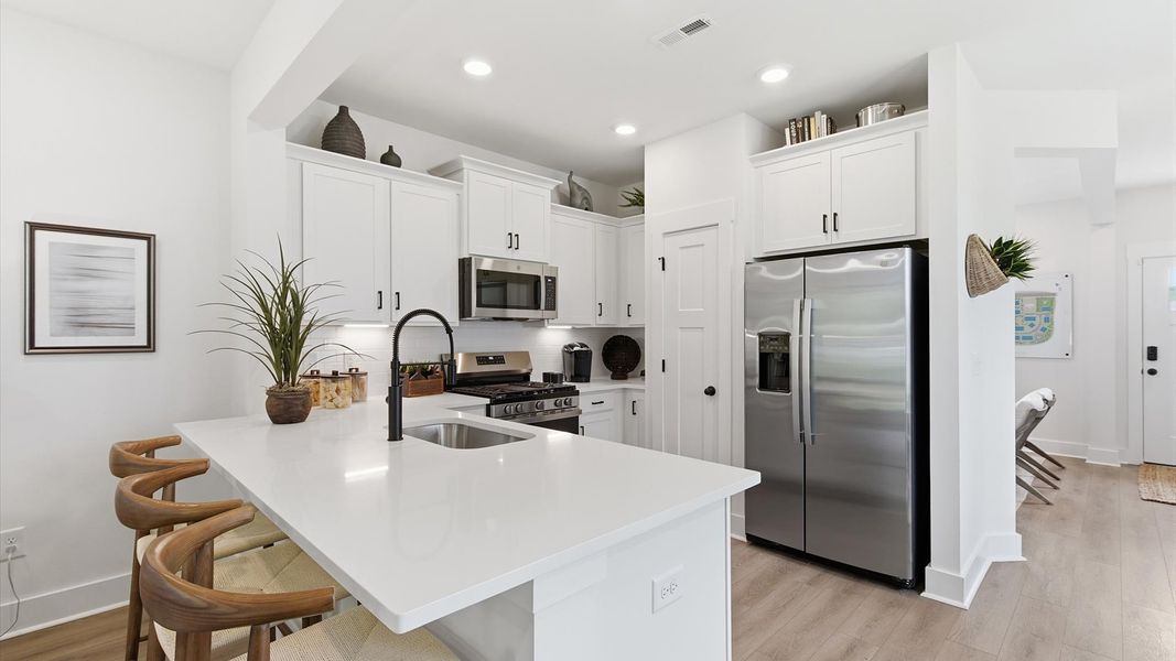 Superior craftsmanship shines in this modern kitchen with an open flow and tasteful decor at this villa in Clarke Townes Superior craftsmanship shines in this modern kitchen with an open flow and tasteful decor at this villa in Clarke Townes