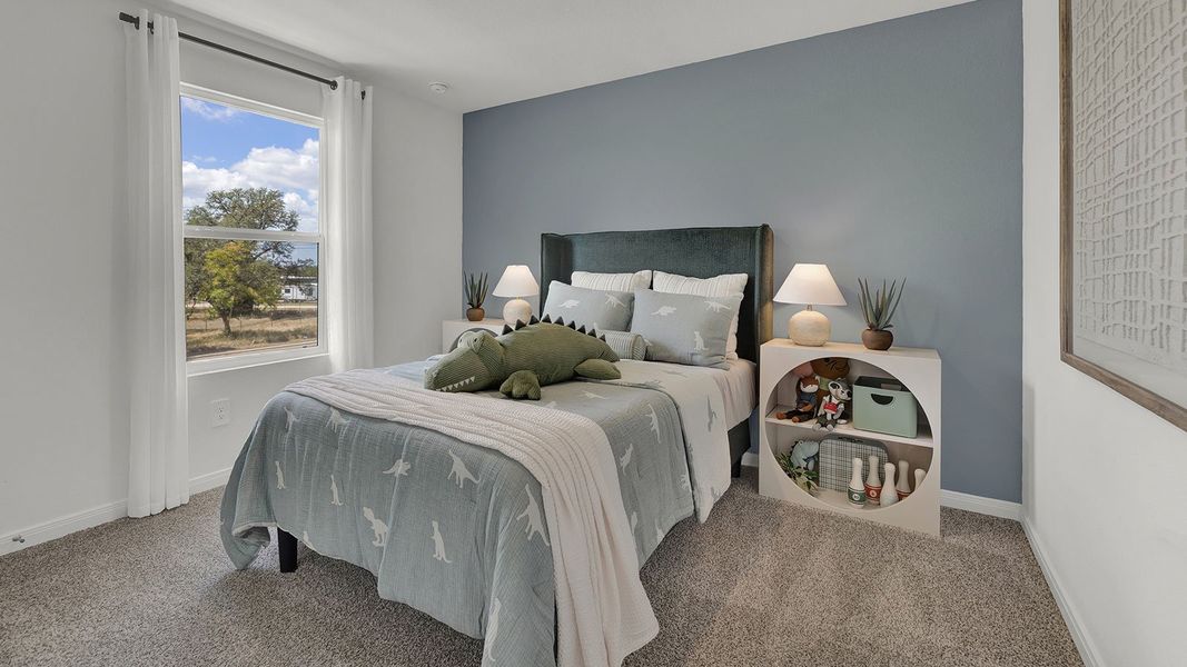 Furnished interior in a model home at Paramount in Kyle (Image 25).