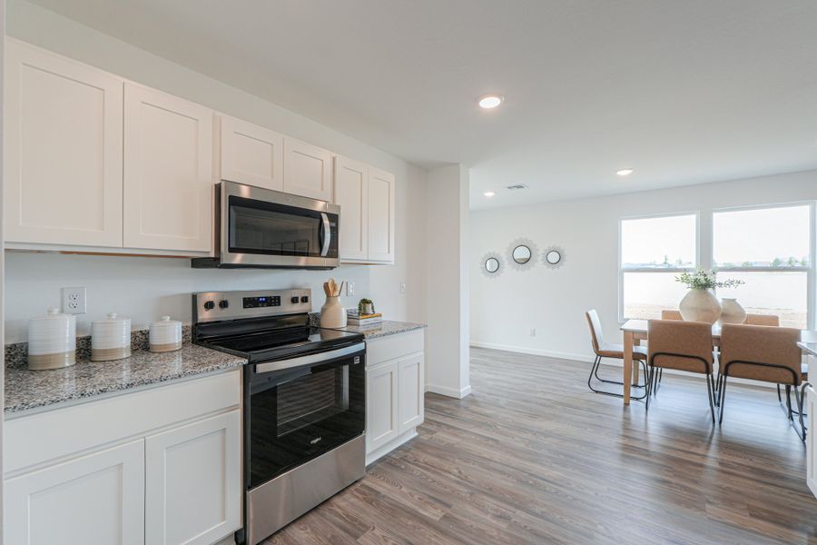 A kitchen with white cabinets. A kitchen with white cabinets.