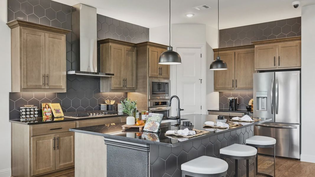 Elegant Morningside kitchen showcases chic hexagonal backsplash and refined wood cabinetry, creating a luxurious ambiance.