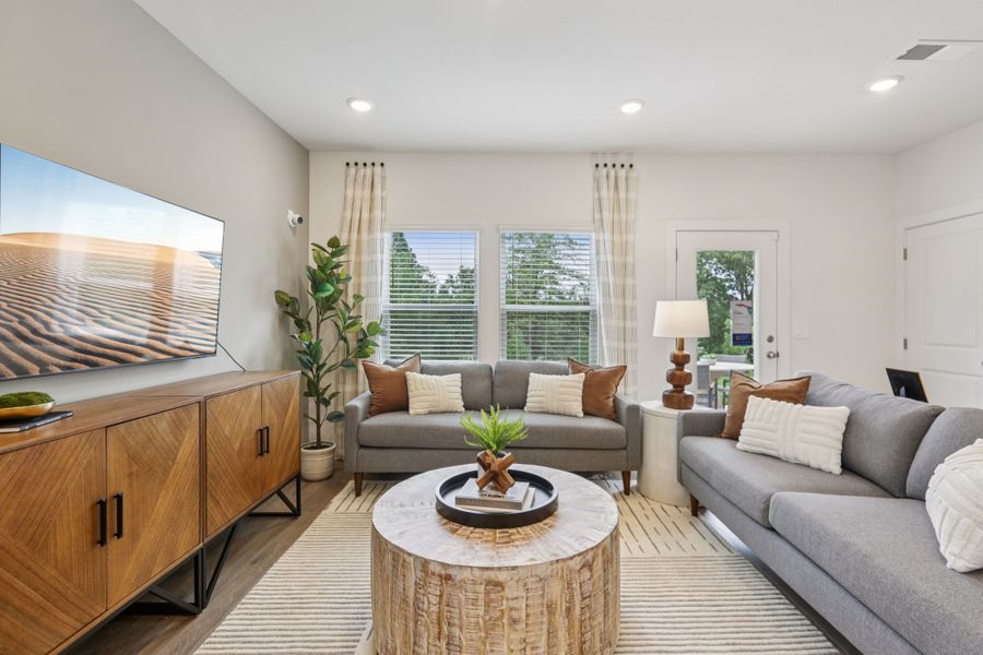 Furnished interior in a model home at Cedarcrest Townhomes in Fairview (Image 10).