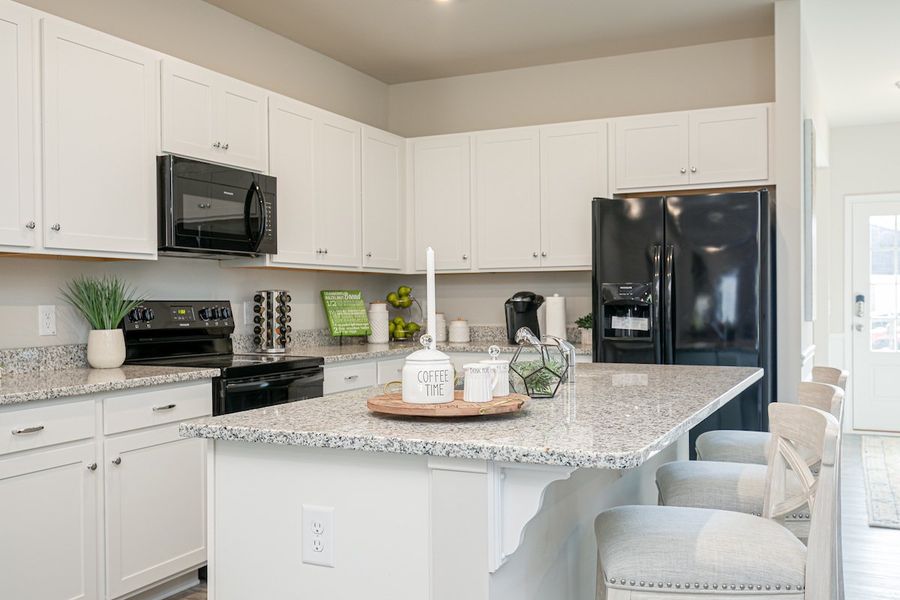Furnished interior in a model home at The Cottages of Silvertown in Thomaston (Image 34).