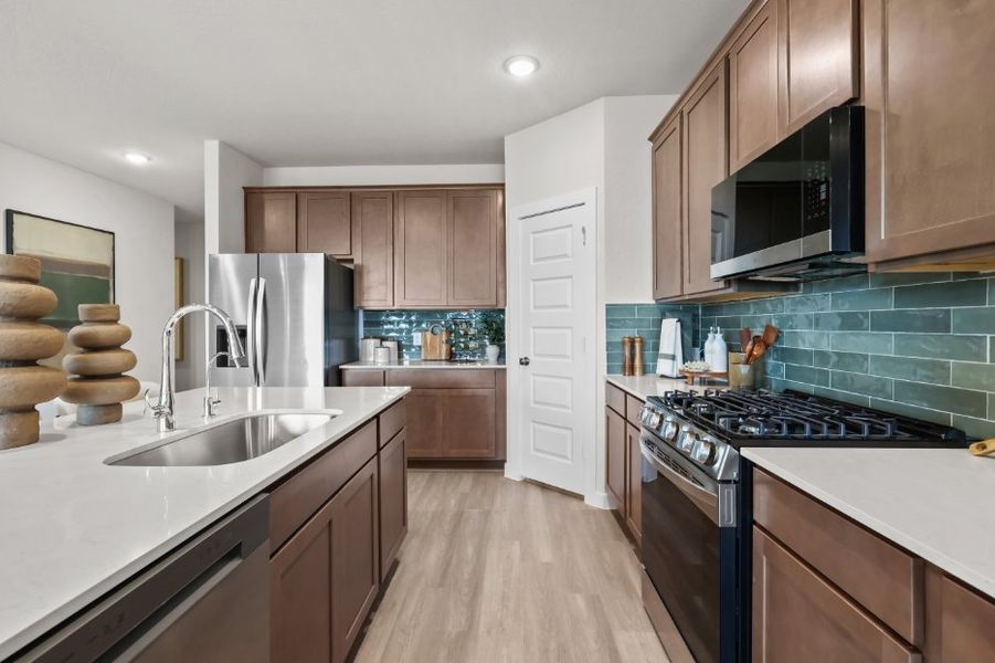 A kitchen with wooden cabinets. A kitchen with wooden cabinets.