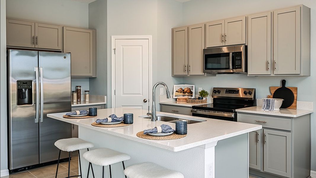 Furnished interior in a model home at Waterstone Townhomes in Groveland (Image 3).