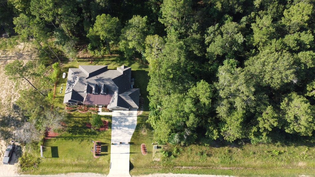Aerial view of the Encino Estates community in Dayton, TX, showing layout and nearby surroundings (Image 3). Aerial view of the Encino Estates community in Dayton, TX, showing layout and nearby surroundings (Image 3).