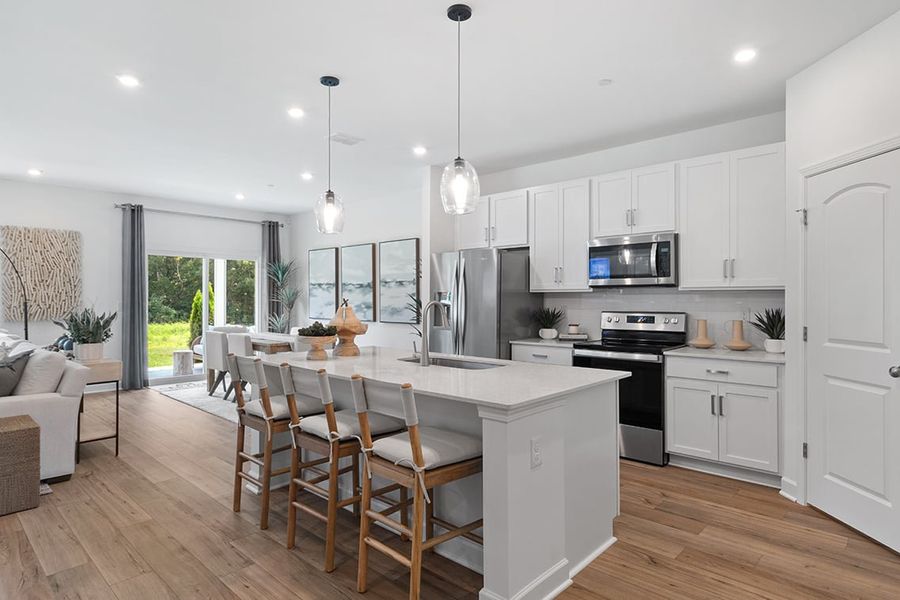 A kitchen with white cabinets. A kitchen with white cabinets.