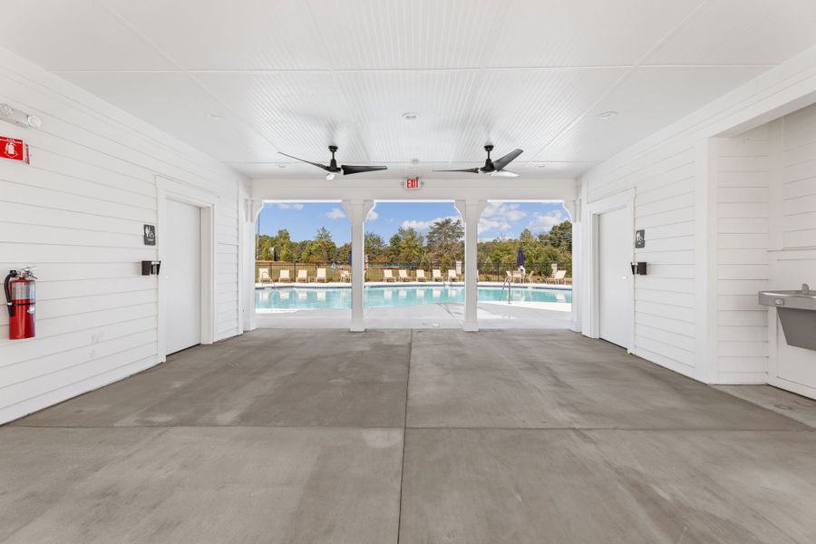 A room with white walls and a large window. A room with white walls and a large window.