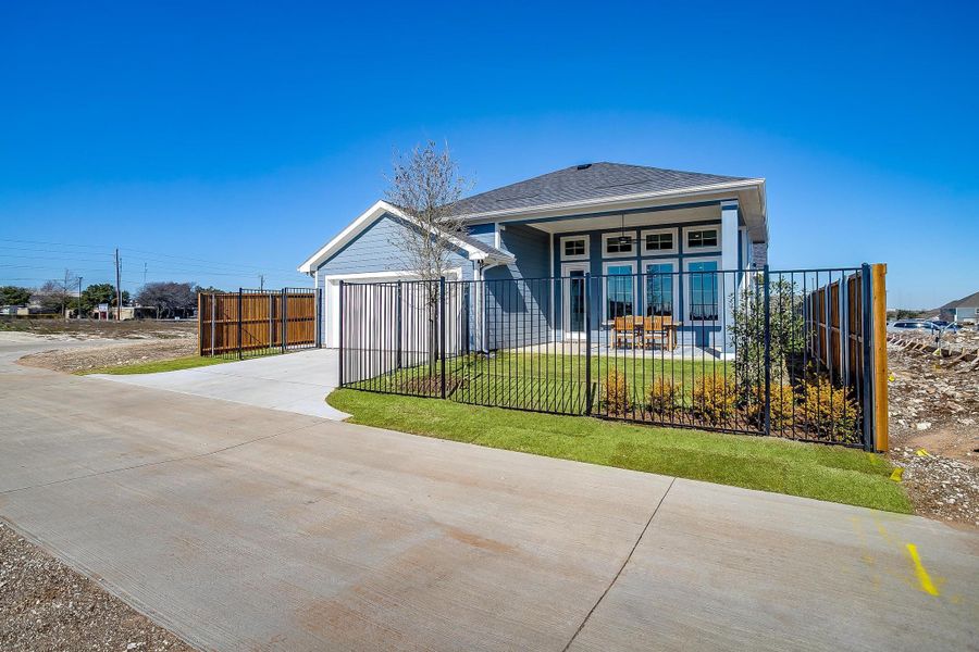Front exterior of a home in the MidTowne community, located in Midlothian, TX (Image 11).