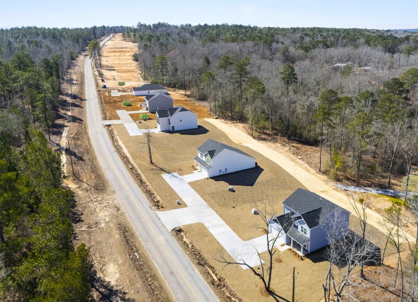 Aerial view of the Harmon Hill Estates community in Hopkins, SC, showing layout and nearby surroundings (Image 1). Aerial view of the Harmon Hill Estates community in Hopkins, SC, showing layout and nearby surroundings (Image 1).