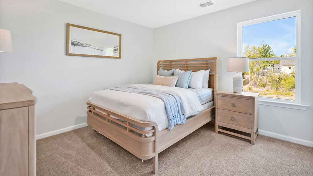 Furnished interior in a model home at Bella Point in Bolivia (Image 26).