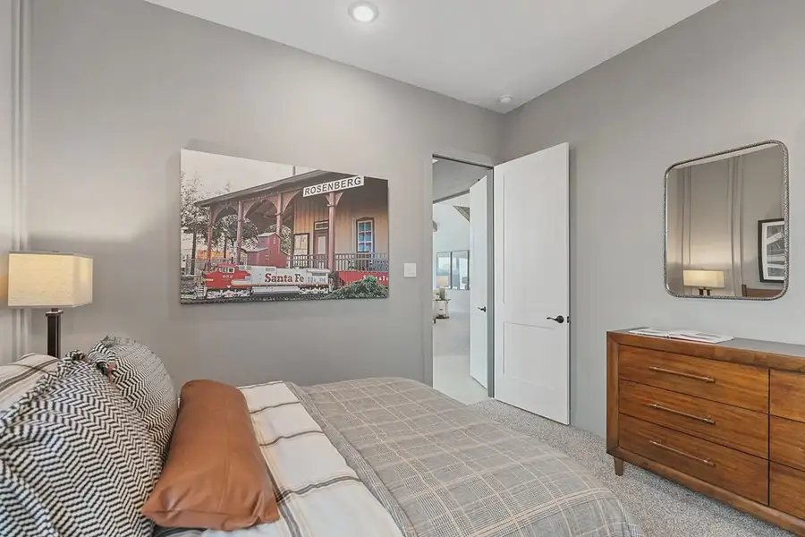 Furnished interior in a model home at Brookewater 60's in Rosenberg (Image 19).