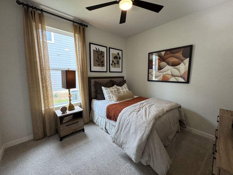 A cozy bedroom featuring modern art, a plush bed with warm linens, and elegant lighting for a serene ambiance. A cozy bedroom featuring modern art, a plush bed with warm linens, and elegant lighting for a serene ambiance.