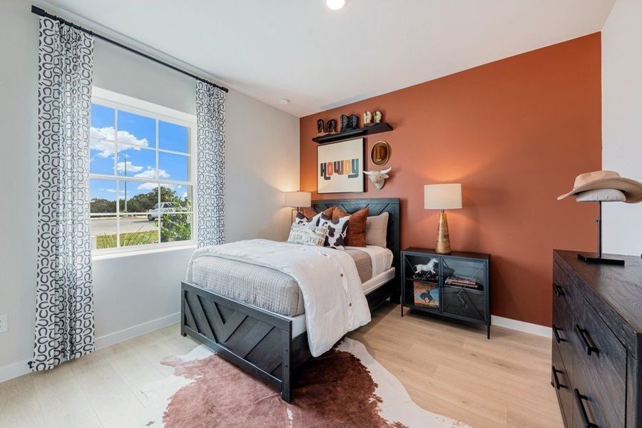 Furnished interior in a model home at The Woodlands in Mico (Image 30).