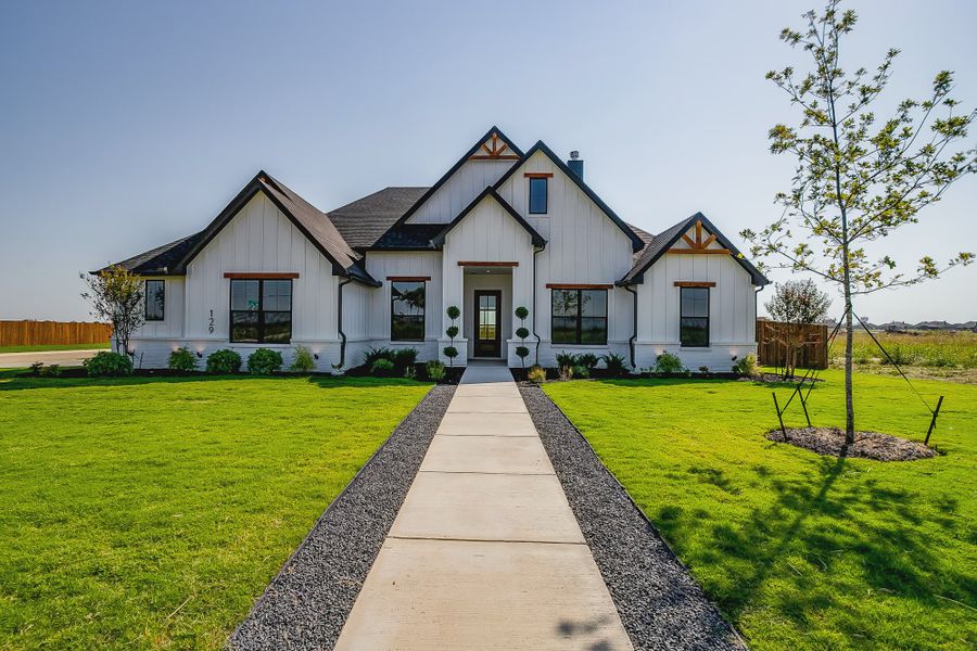 Front exterior of a home in the Coyote Crossing community, located in Godley, TX (Image 4). Front exterior of a home in the Coyote Crossing community, located in Godley, TX (Image 4).