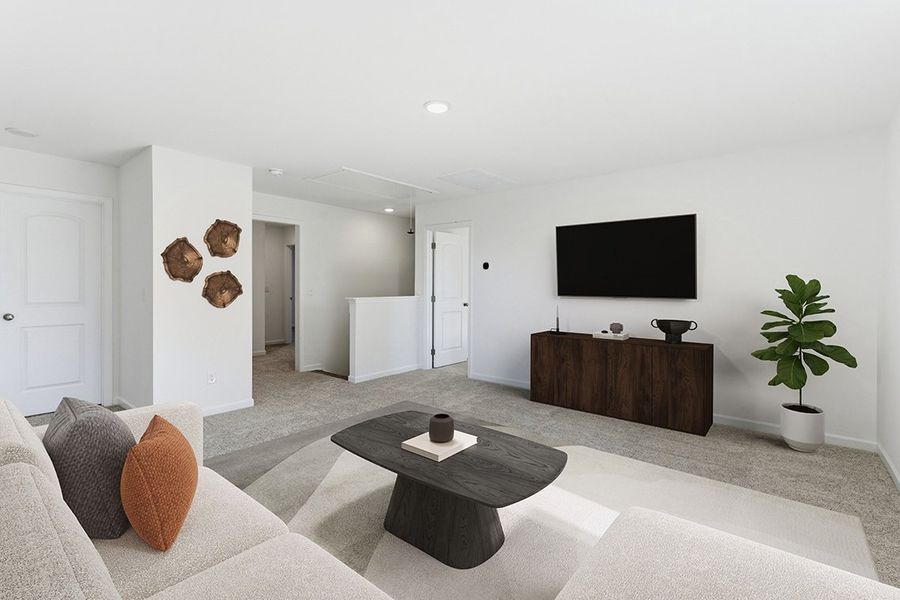 A living room with a tv and a coffee table.