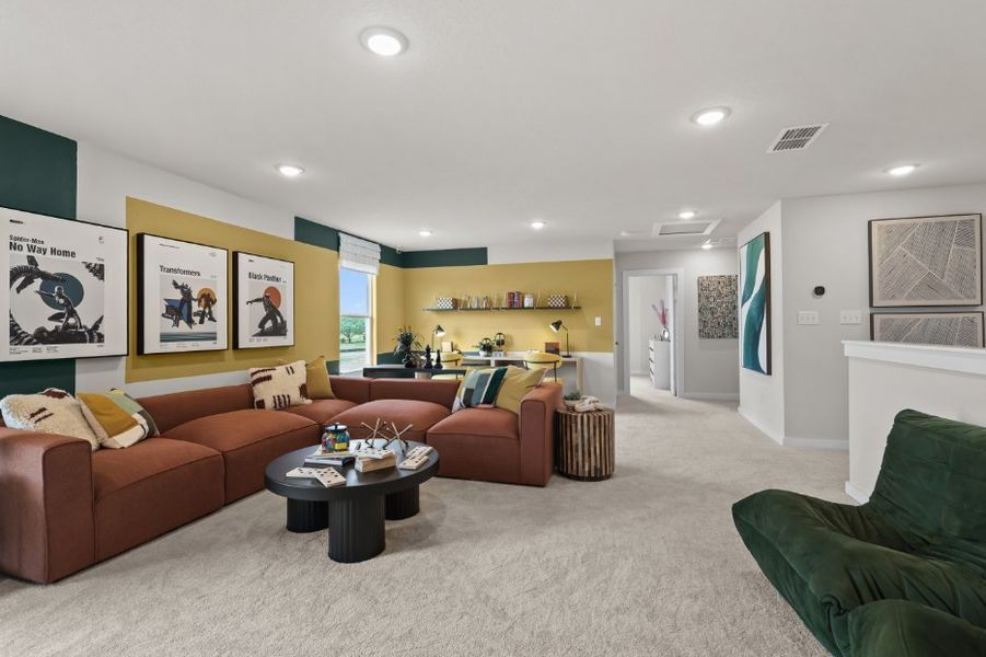 A living room with a couch and a coffee table. A living room with a couch and a coffee table.