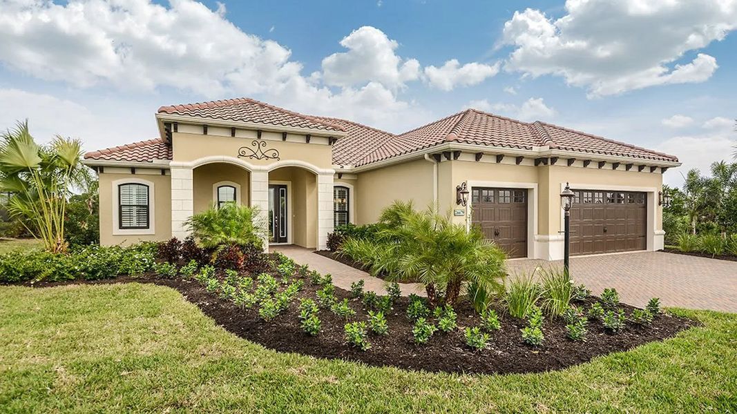 Front exterior of a home in the Boca Royale Golf & Country Club Real Estate and Homes for Sale in Englewood, FL - Neal Communities community, located in Englewood, FL (Image 5).
