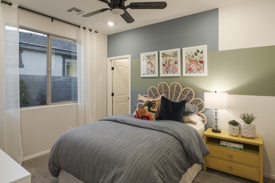 Furnished interior in a model home at Windrose V in Waddell (Image 37).