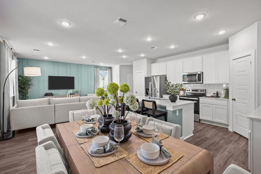 A kitchen with a table and chairs. A kitchen with a table and chairs.