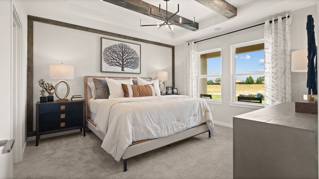 The Primary Suite at Grasslands West featuring a gorgeous view of Grasslands Golf Course at Grasslands West in Lakeland FL.